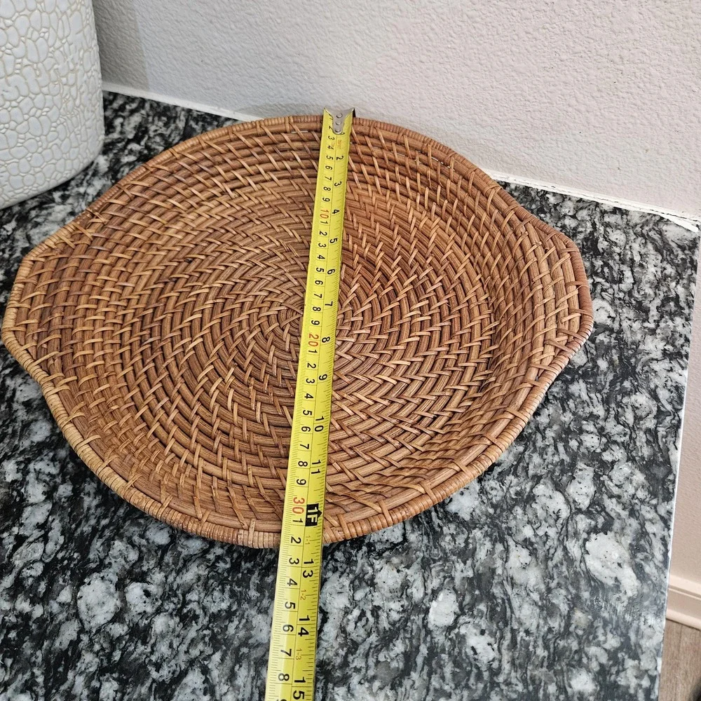 hand-woven rattan tray with a distinct spiral patterns serving plate